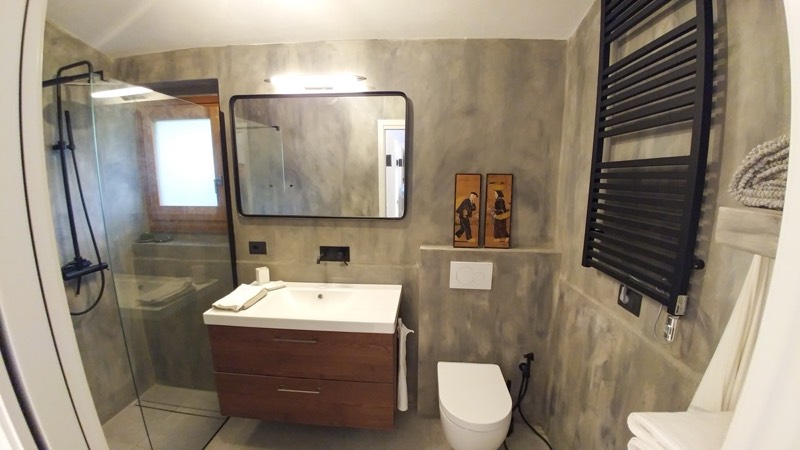 Modern bathroom with walk-in shower and wooden vanity