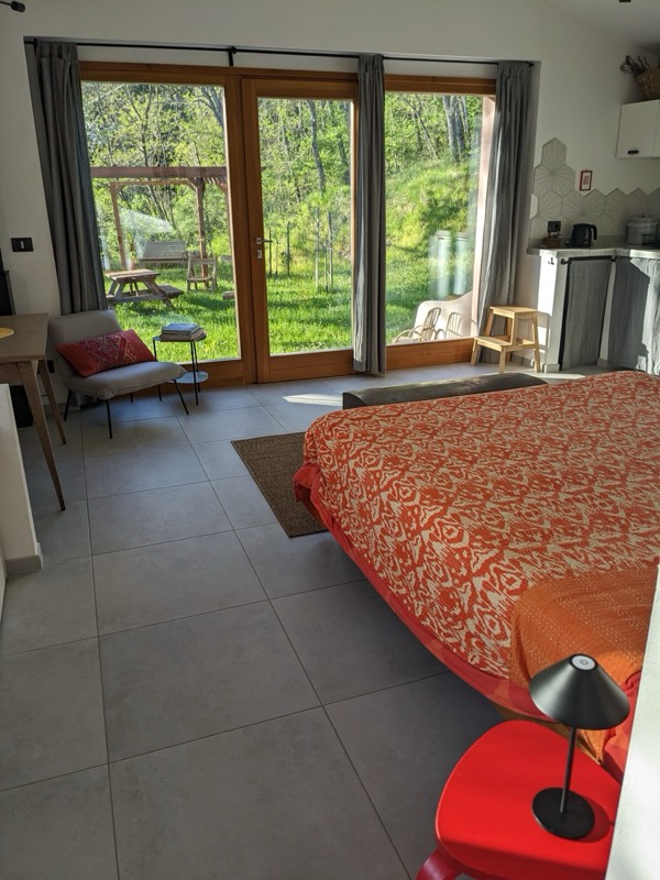 Floor-to-ceiling glass doors opening to garden